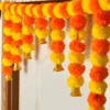 Marigold toran with bells orange and yellow color flower for pooja mandir,main door ,home entrance